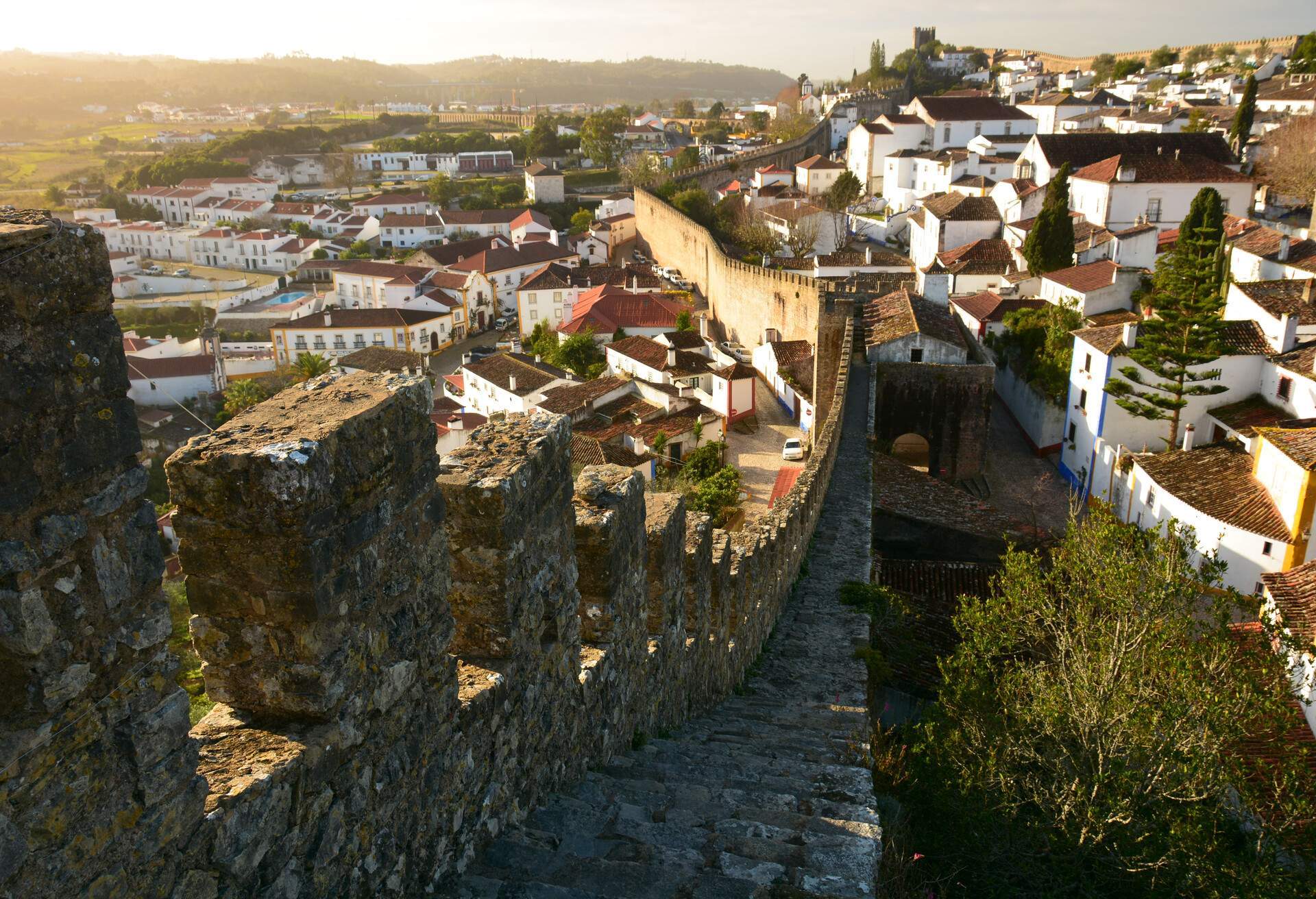 a look over the town of Obidos on the surrounding ancient citywall during sunrise
