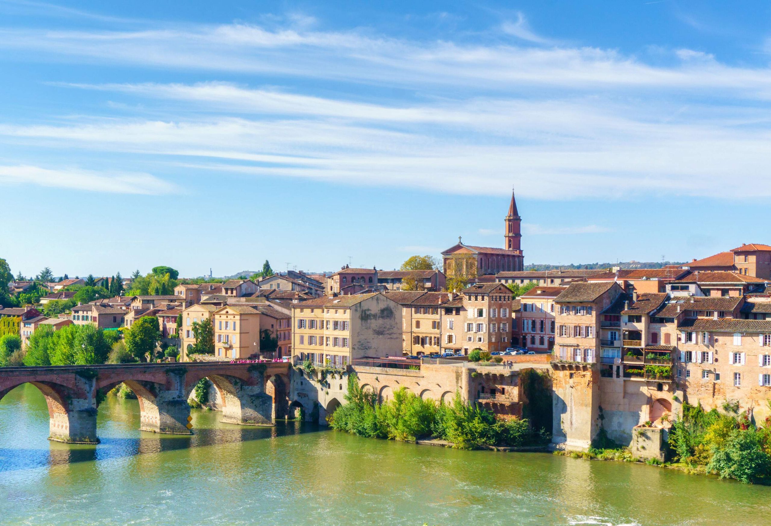 An old river bridge linked to a historic town with a remarkable cathedral church.