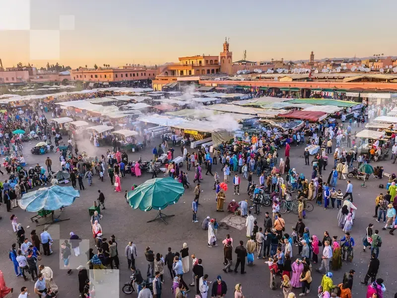 Famous Djemaa El Fna Square in early evening light, Marrakech, Morocco with the Koutoubia Mosque, Northern Africa.Nikon D3x