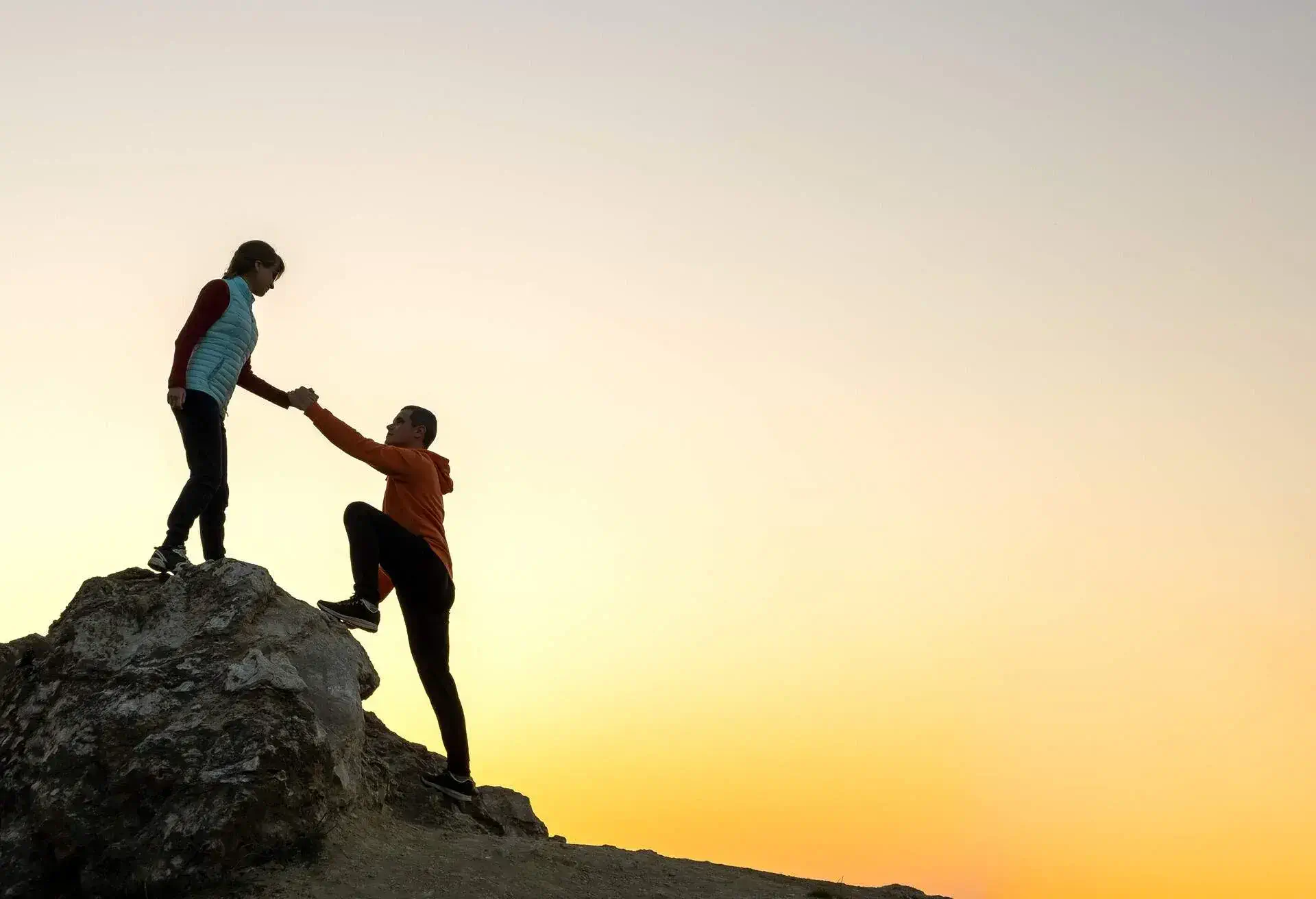 adventure couple climbing