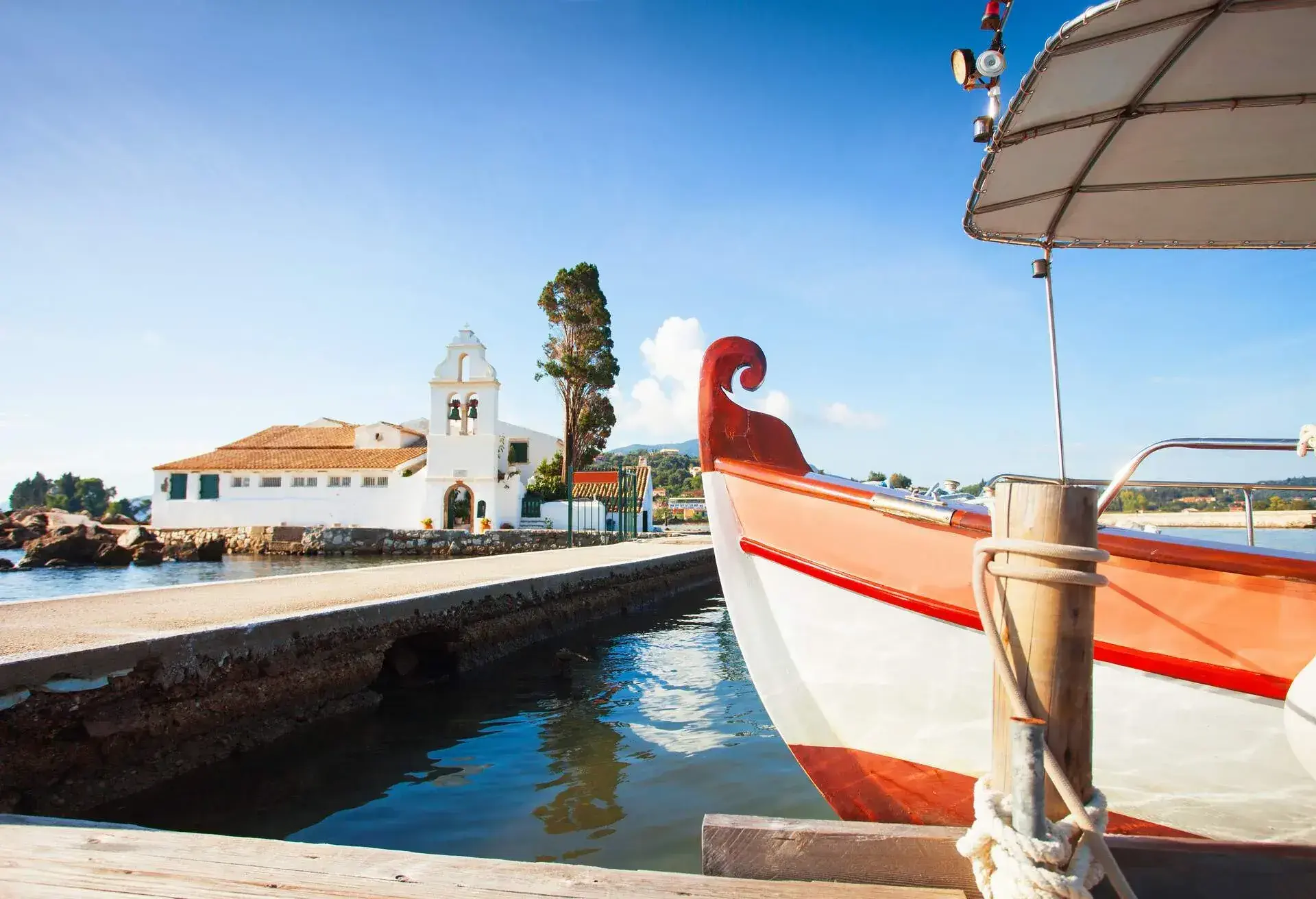 DEST_GREECE_CORFU_Traditional greek boat near Vlacherna Monastery_GettyImages-500542538