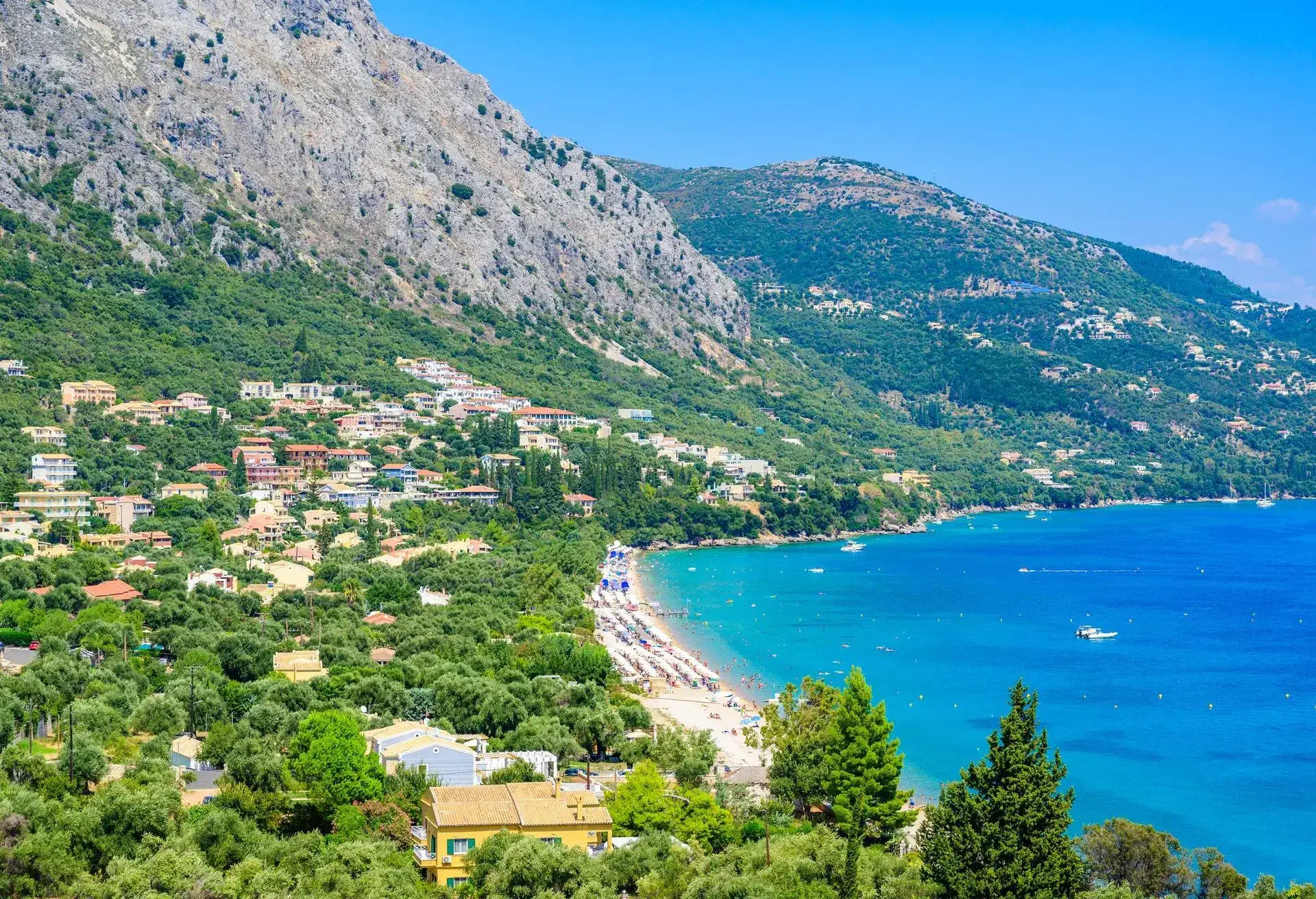 Barbati Beach with crystal clear azure water in beautiful landscape scenery - paradise coastline of Corfu island, Ionian archipelago, Greece.