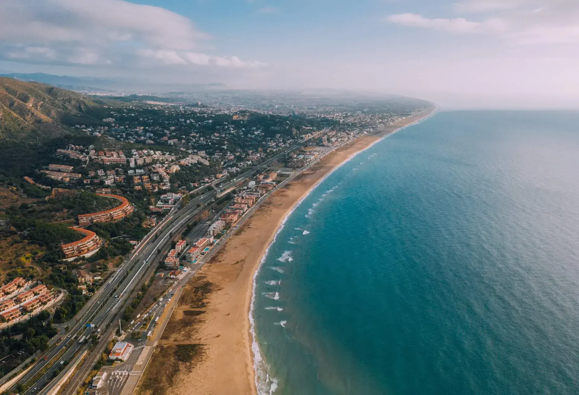 Aerial view of Castelldefels Coast. Castelldefels is a municipality in the Baix Llobregat comarca, in the province of Barcelona in Catalonia, Spain, and a suburban town of the Metropolitan Area of Barcelona. Its population is 65,954.