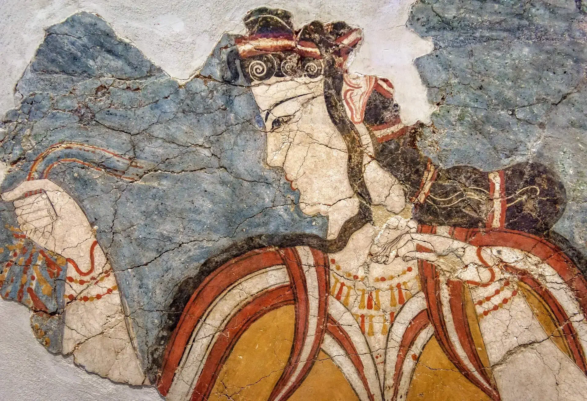Ancient Greek fresco of woman. Remains of the culture of ancient civilization in Greece. Beautiful antique wall painting, old Greek art. Cracked mural close-up.