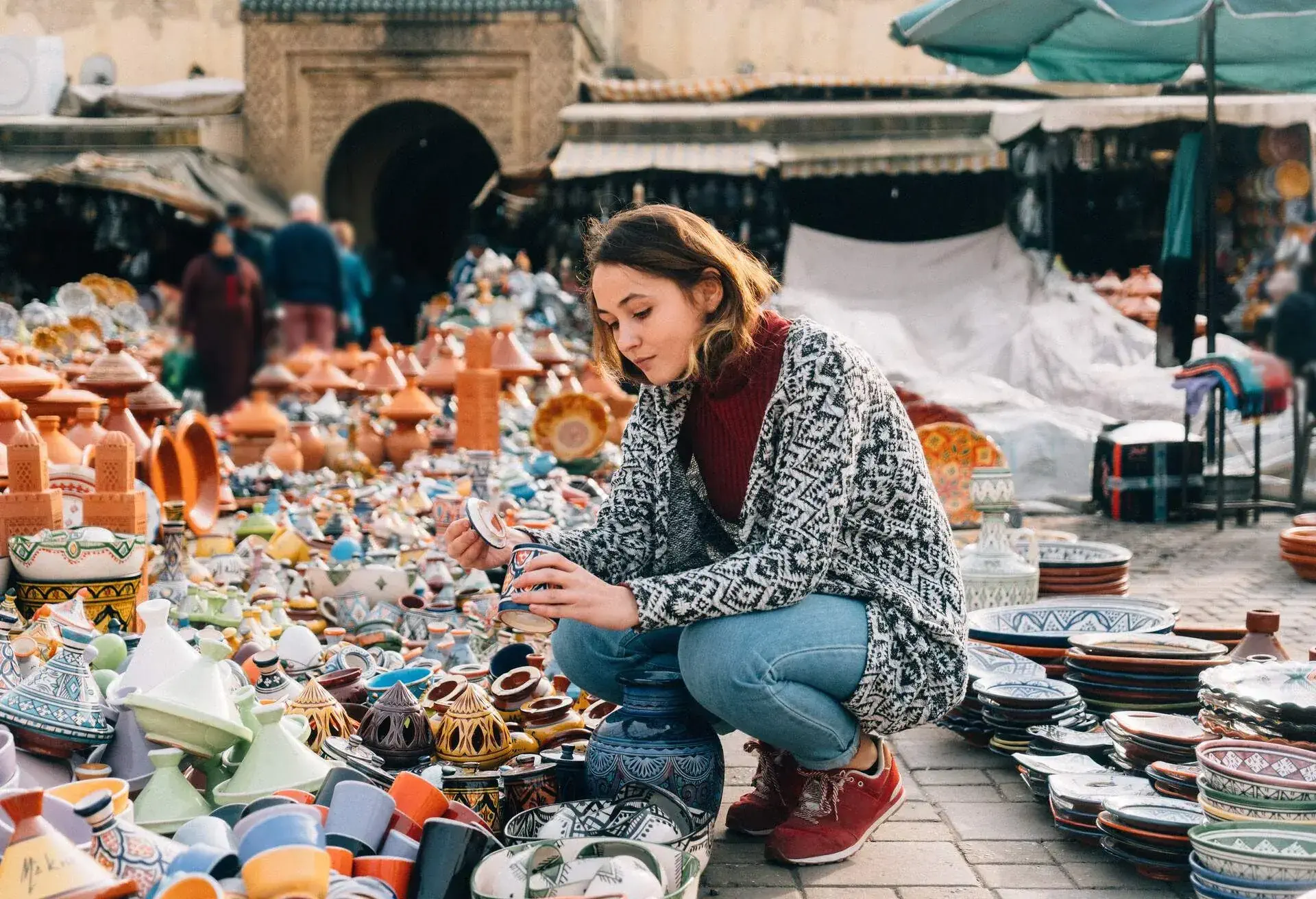 Young Caucasian woman choosing Ceramic in shop in Meknes, Morocco