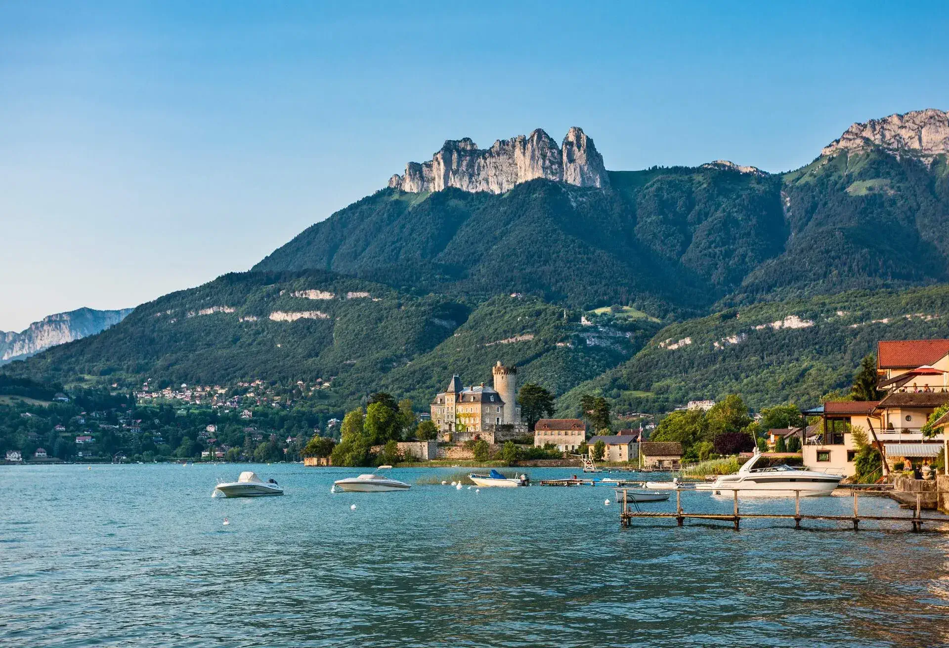 France, Haute-Savoie department, view of Duingt Castle (Château de Duingt) on the west bank of Lake Annecy at the town of Duingt against the backdrop of the La Tournette mountains