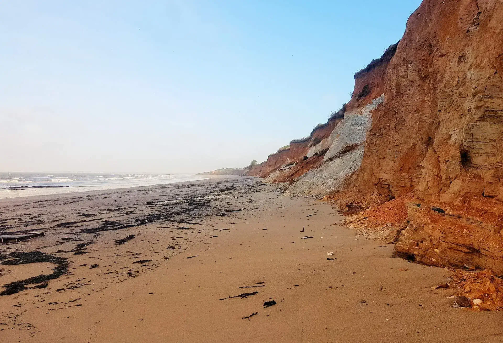 Plage de la Mine d'Or in the Municipality of Penestin - Morbihan department - France.Magnificent landscape with its ocher and yellow cliffs. It owes its name to the presence of a gold mine in the 19th century