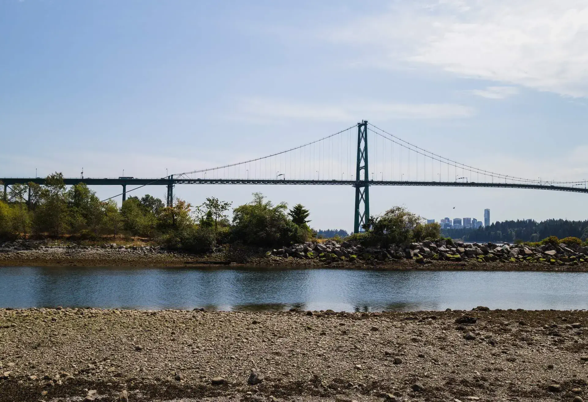 the lions gate bridge viewed from ambleside beach
