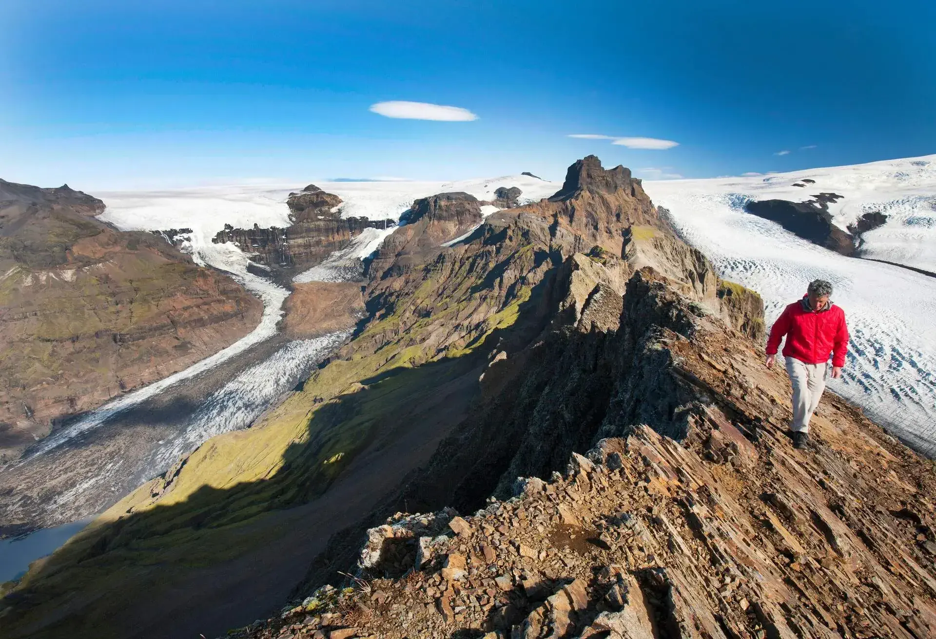 A mountaineer on the summit of Kristinartindar above Skaftafellsjokull in the Skaftafell National Park, Iceland.