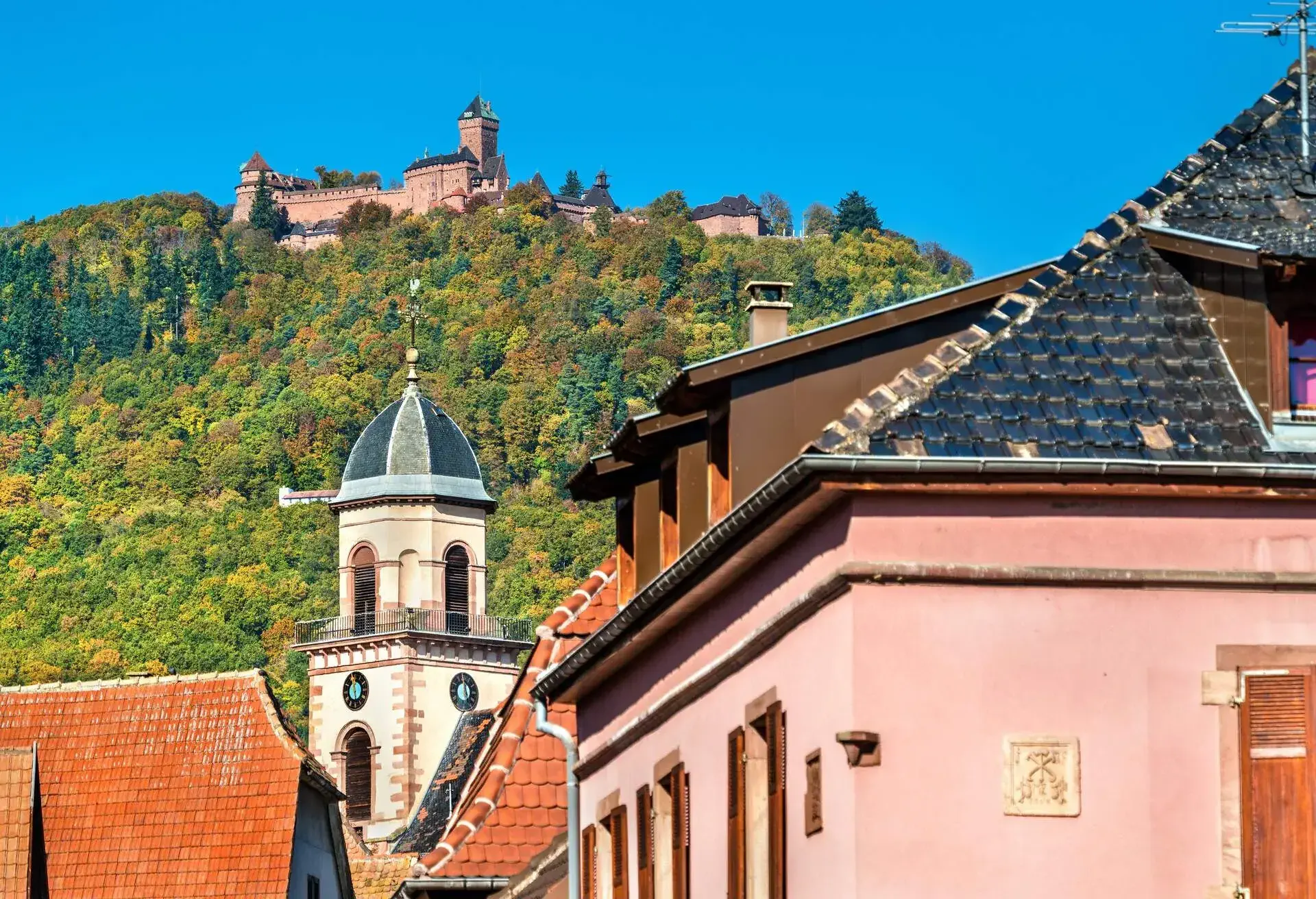 Saint-Hippolyte village with Haut-Koenigsbourg castle on top of a mountain - Haut-Rhin, France