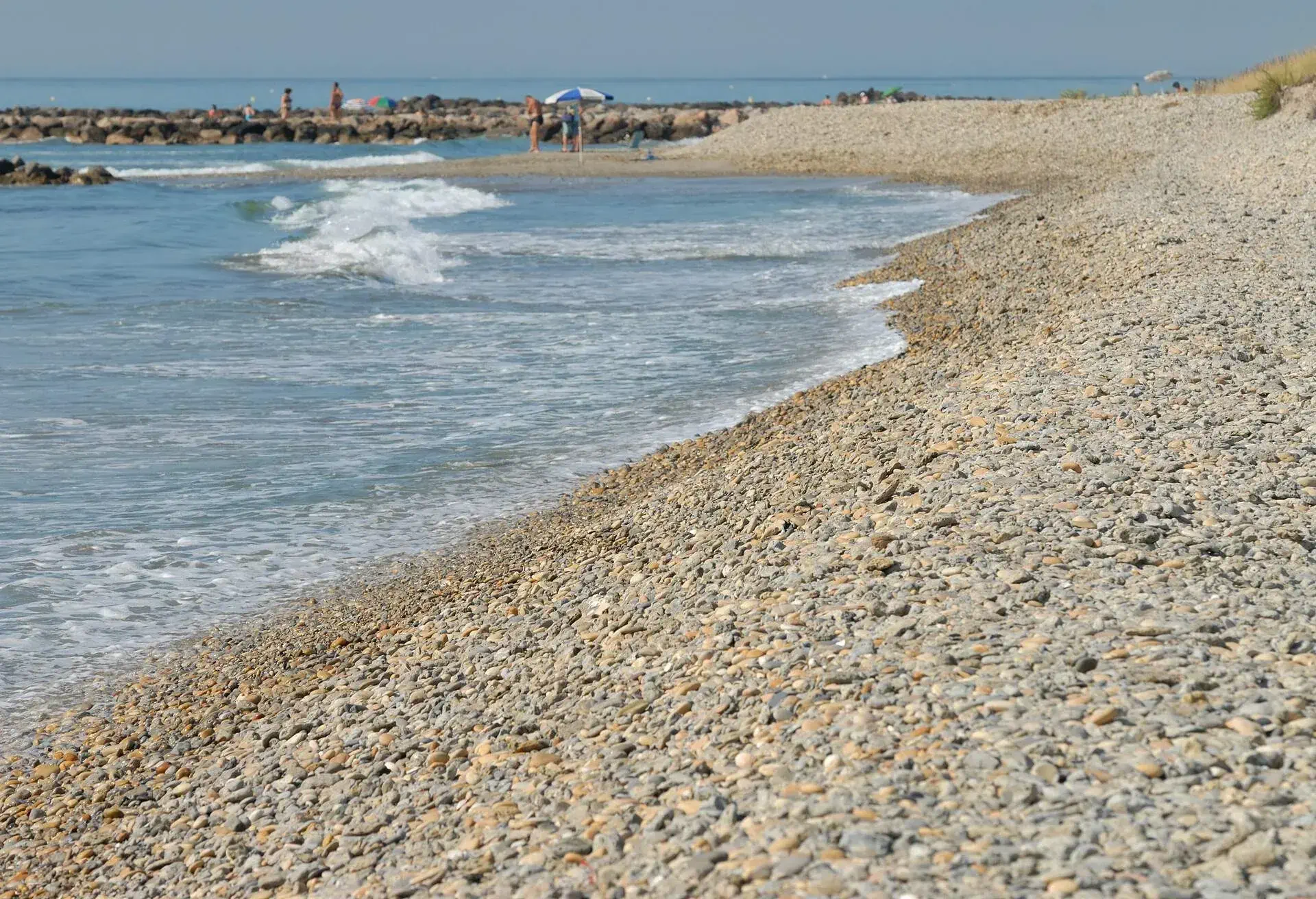 Frontignan, pebble beach at Aresquiers (between Montpellier and Séte). Hérault, Languedoc-Roussillon, Occitanie, France