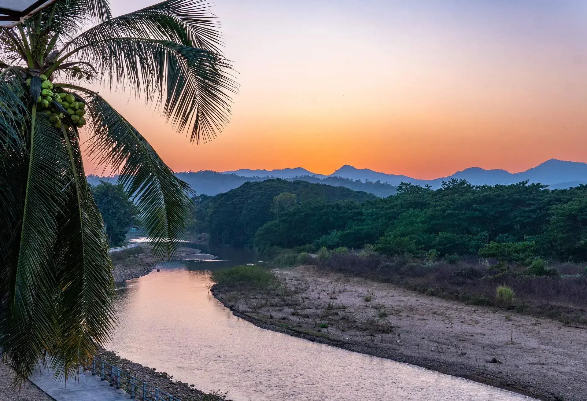 Sun setting over the mountains in the northern Thai town of Mae Sariang