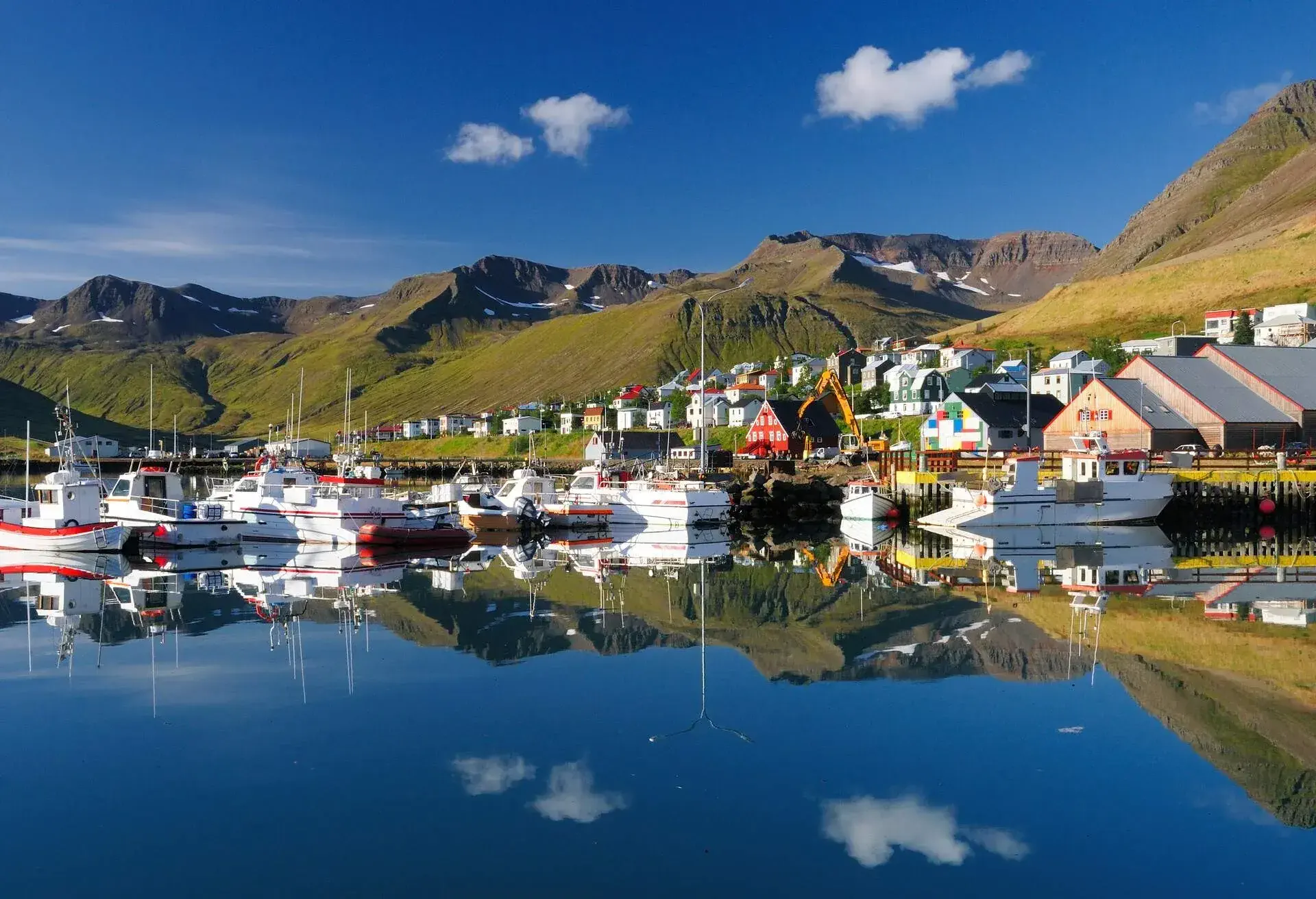 Boat parking at the jetty of the town in Siglufjorour. Northern Iceland; Shutterstock ID 227411155; Purpose: blog mm pt; Brand (KAYAK, Momondo, Any): momondo