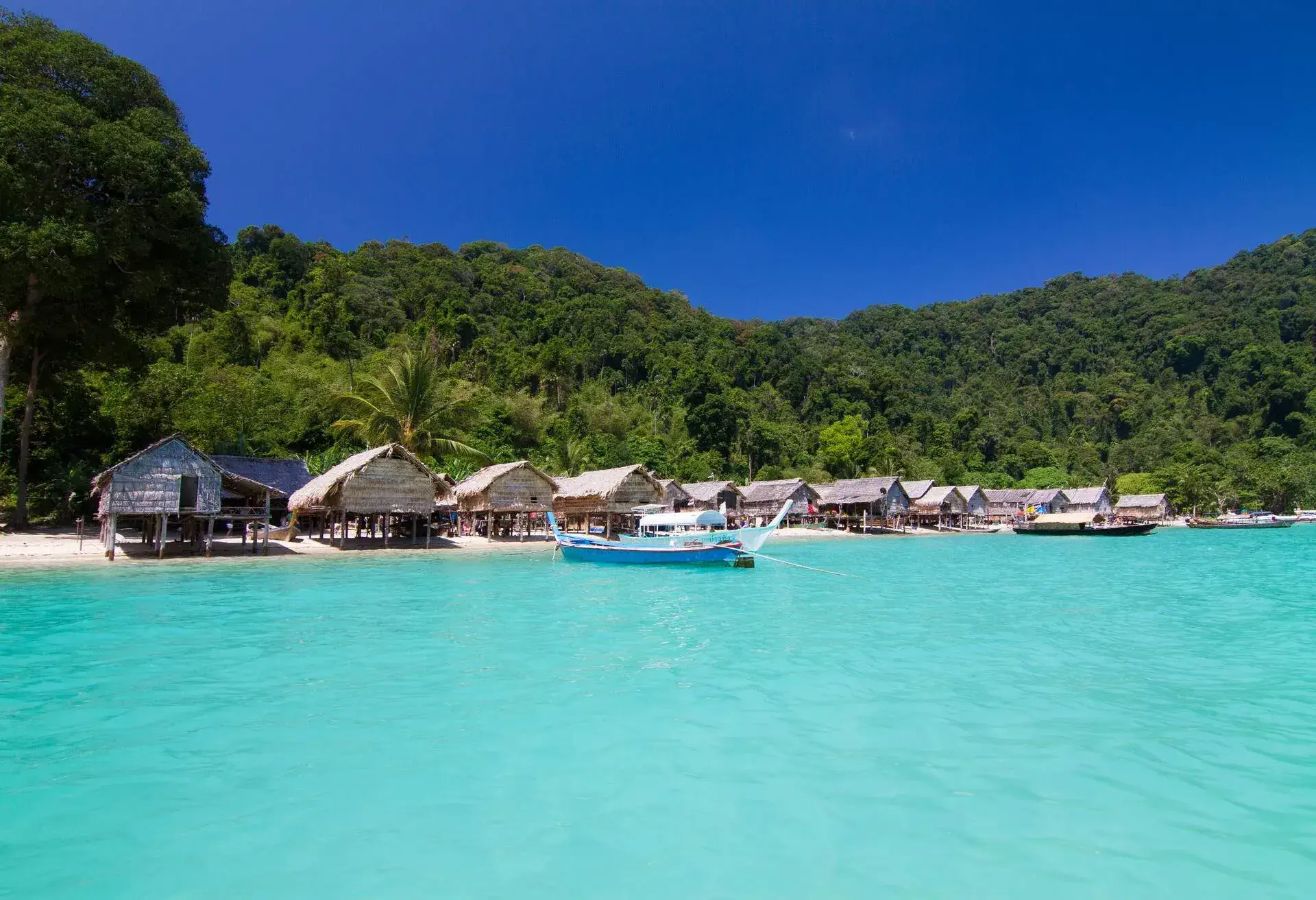 The Moken Sea Gypsy Village at Koh Surin Tai in the Mu Ko National Park, Surin Islands of Thailand with its thatched houses on stilts.