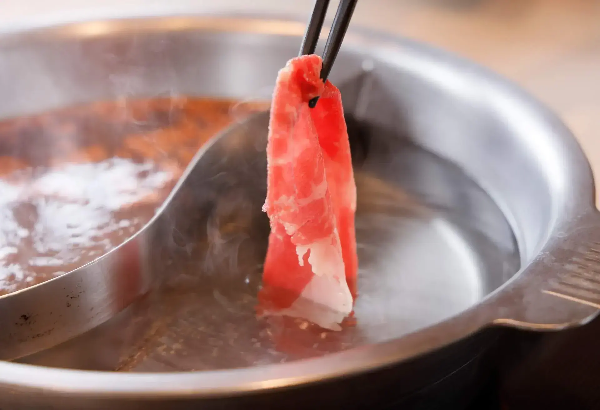 Delicious meat dish made in an iron pan