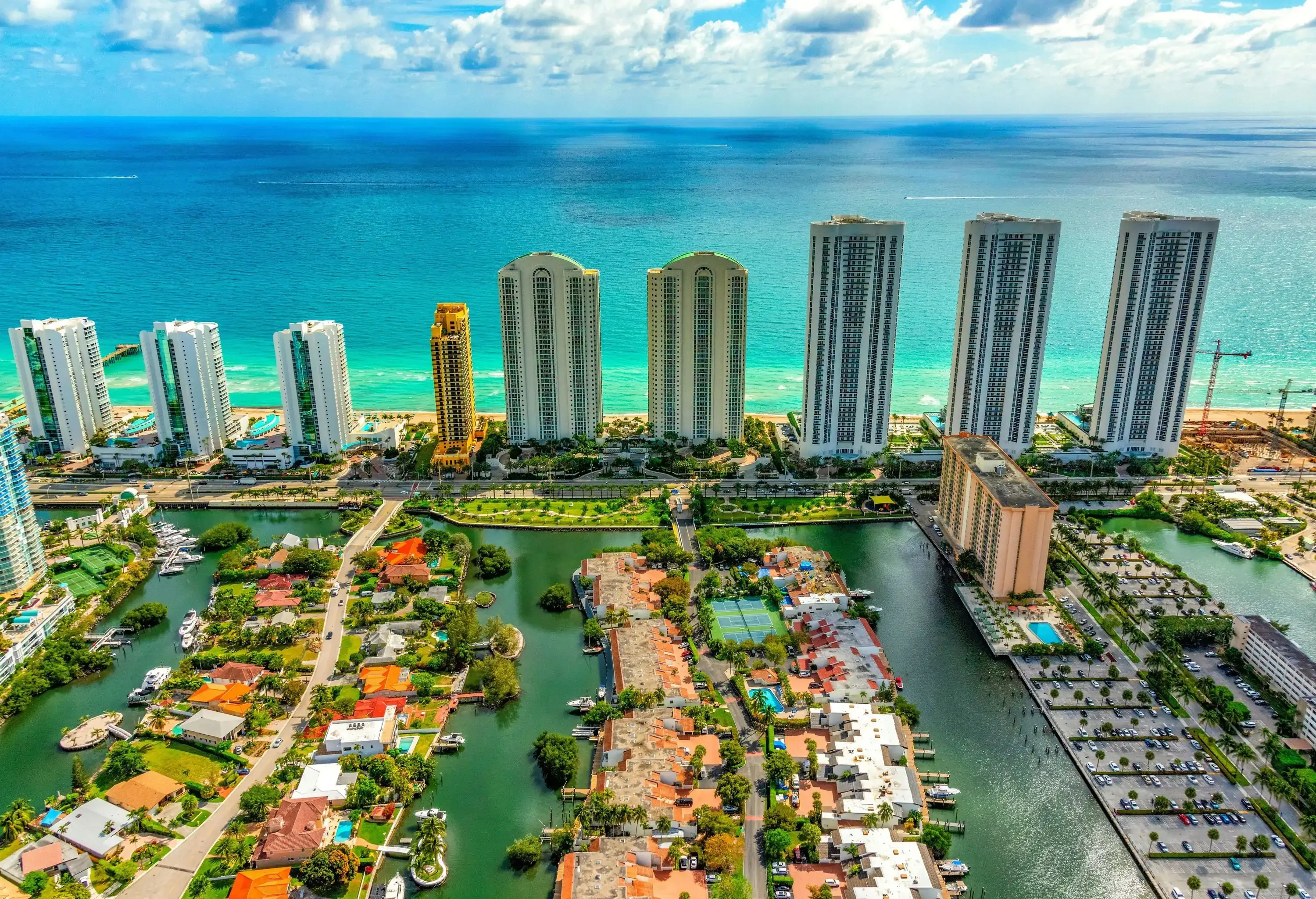 Aerial view of the coastline of South Florida with hotels lining the beaches between Miami and Fort Lauderdale from an altitude of about 800 feet.