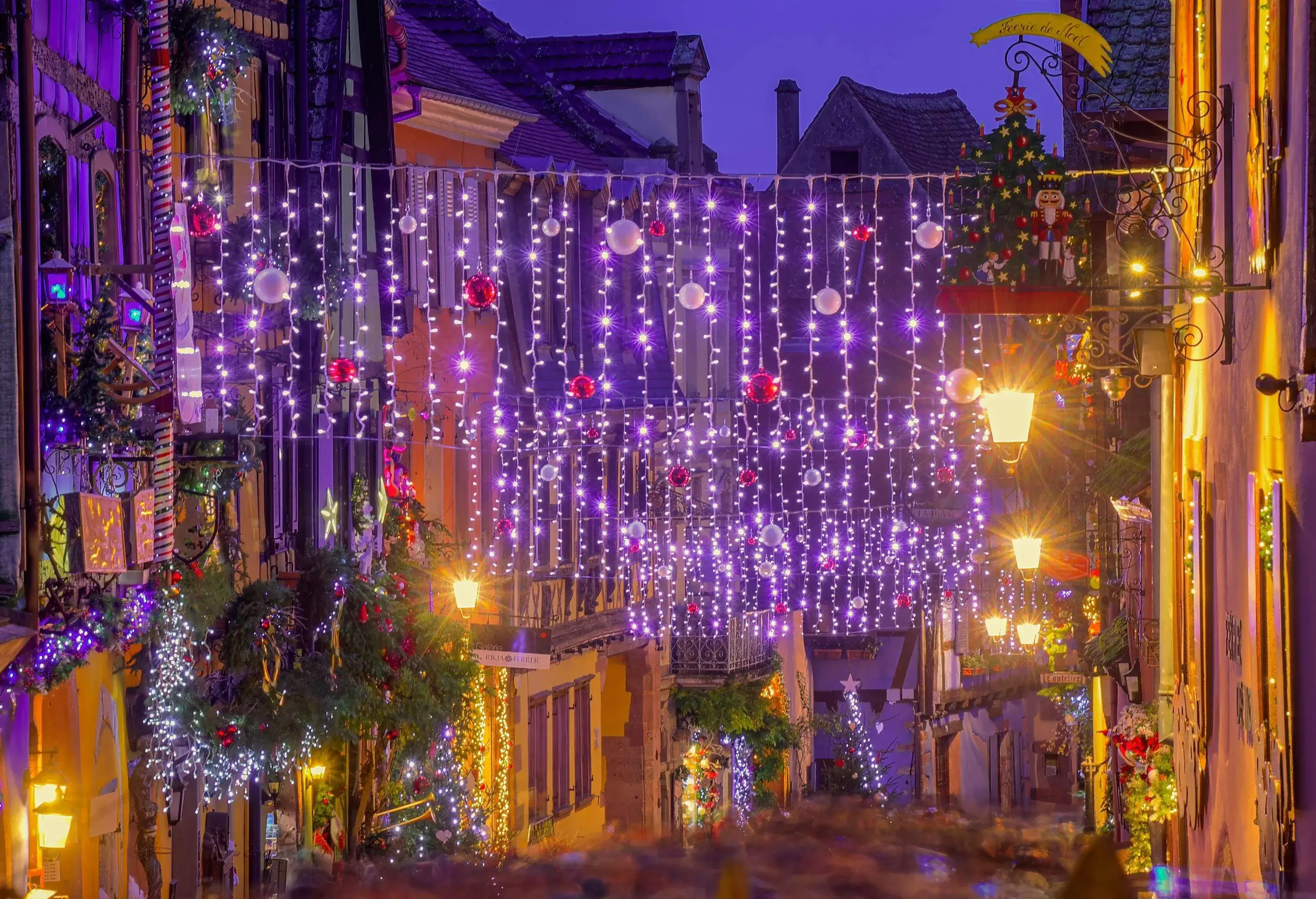 Medieval town in the historical region of Alsace, illuminated street at Christmas