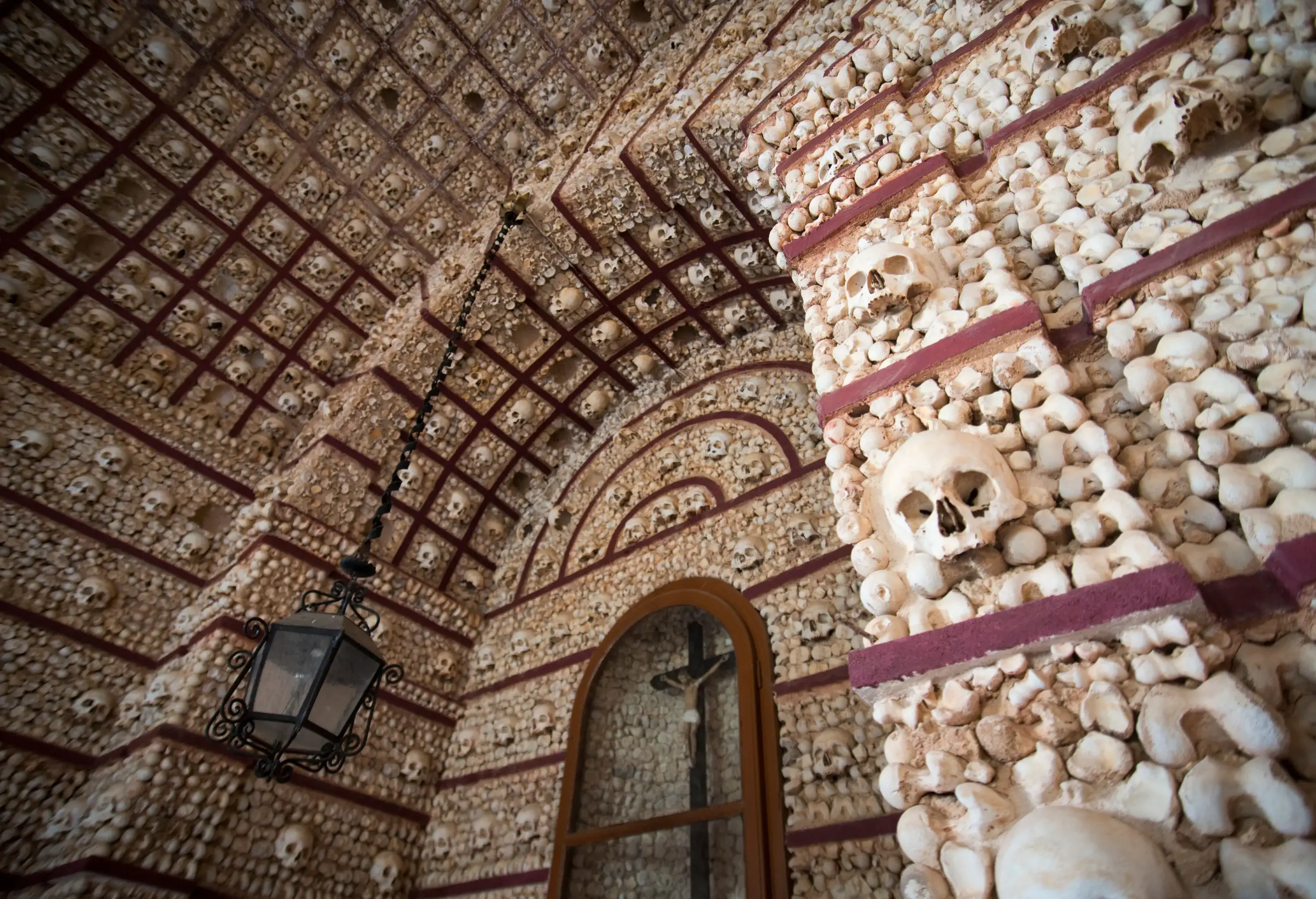 The inner walls and ceiling of the small chapel are decorated with bones and skulls.