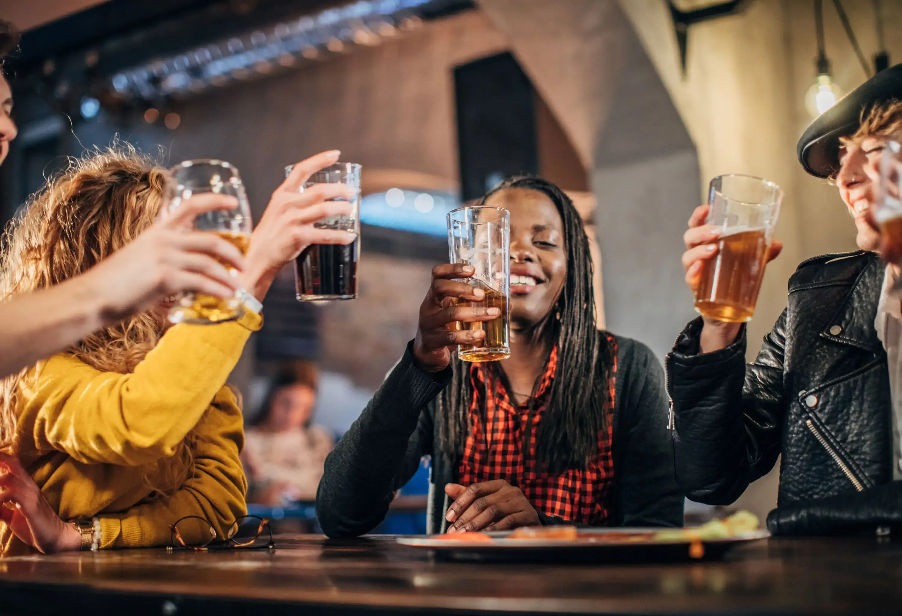 A group of friends having drinks at a bar.