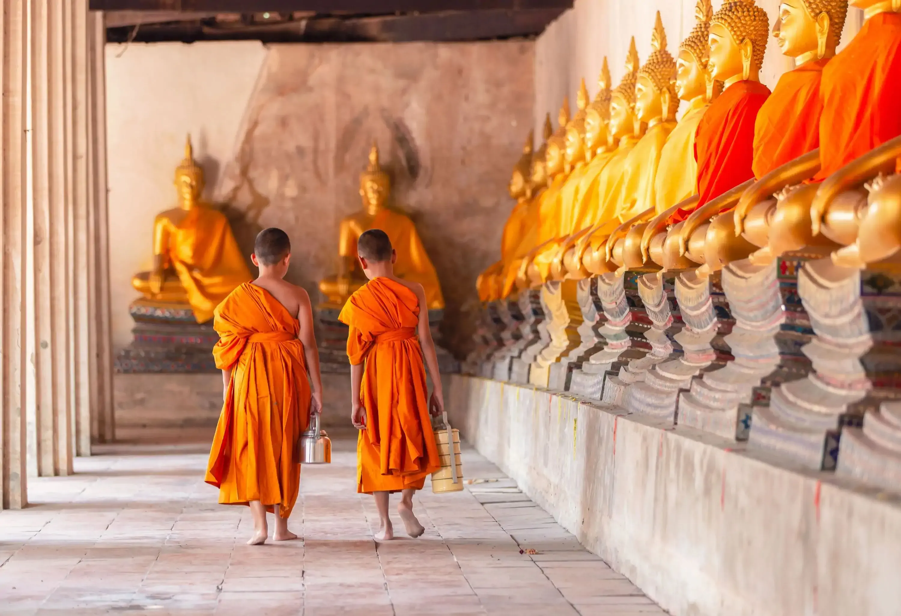 Two novices walking return and talking in old temple at Ayutthaya Province, Thailand