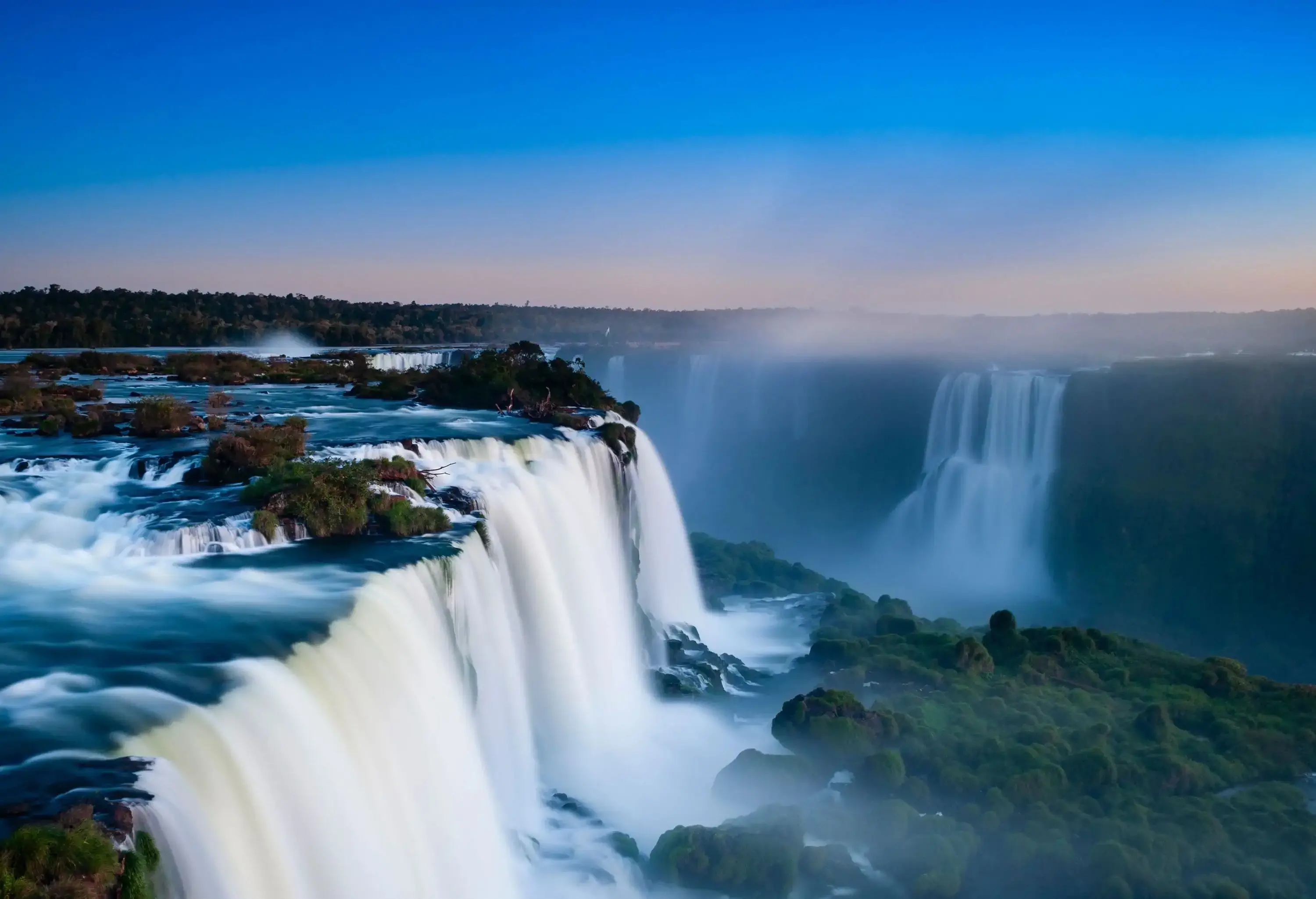 Iguaçu Falls seen from above at sunrise