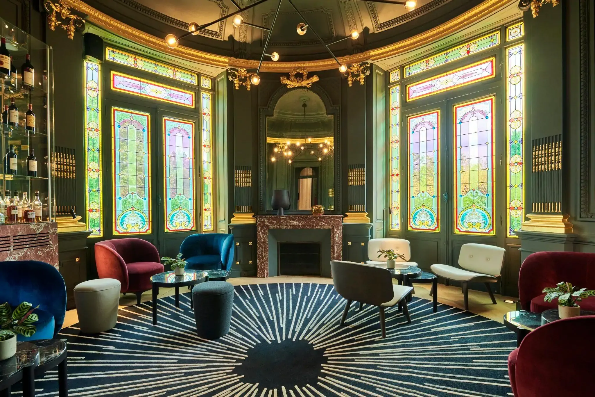 semi circular lobby of a grand hotel in a castle with stained glass windows